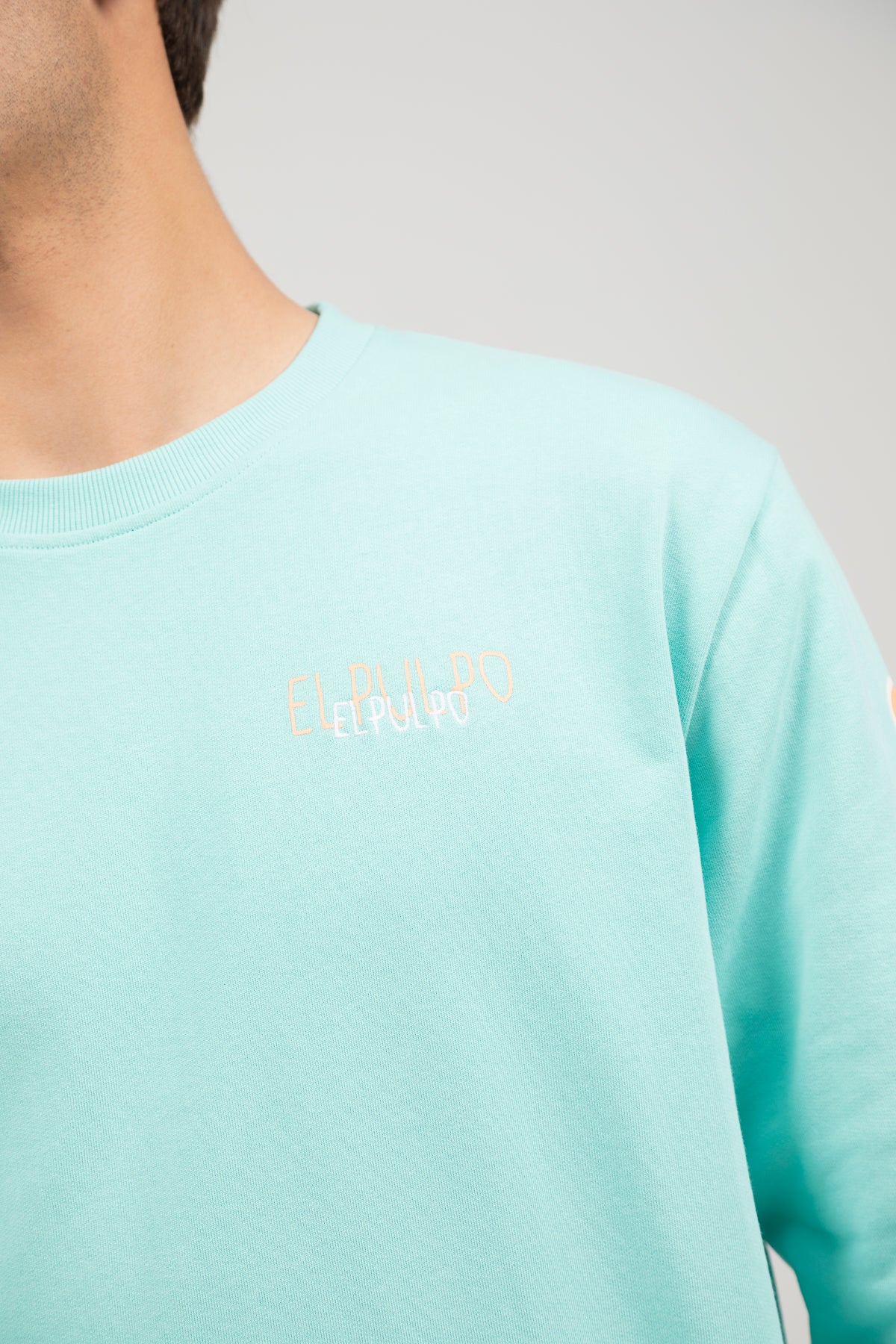Sudadera logo multiposición verde agua