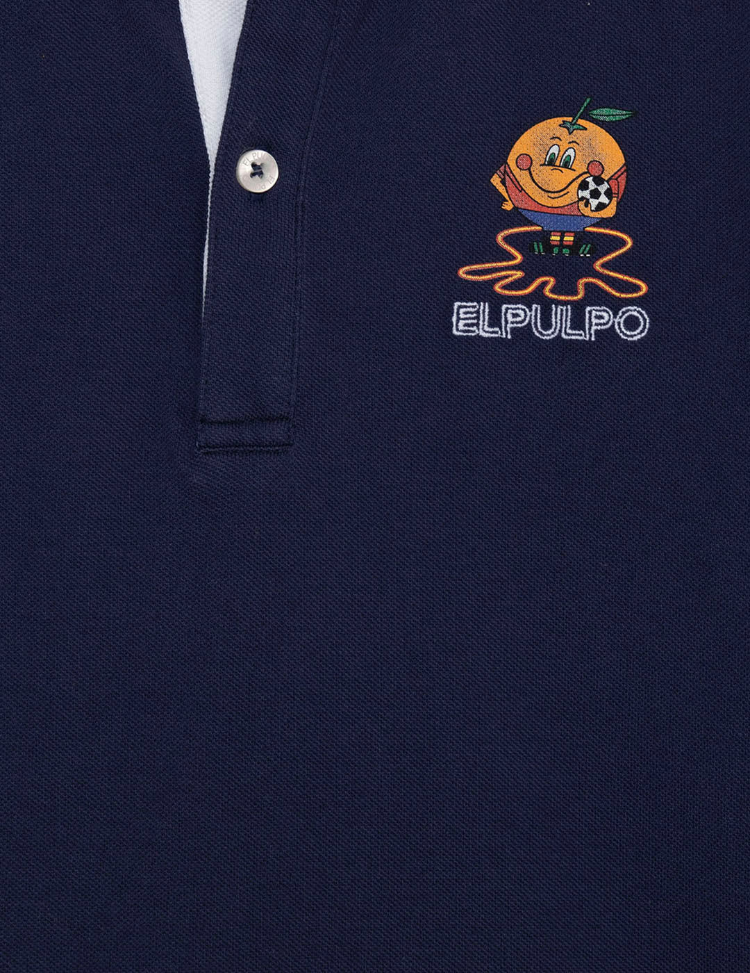 CAMISOLA POLO MENINA COM ESTAMPA DE POLVO E LARANJA COM CONTRASTES AZUL MARINHO
