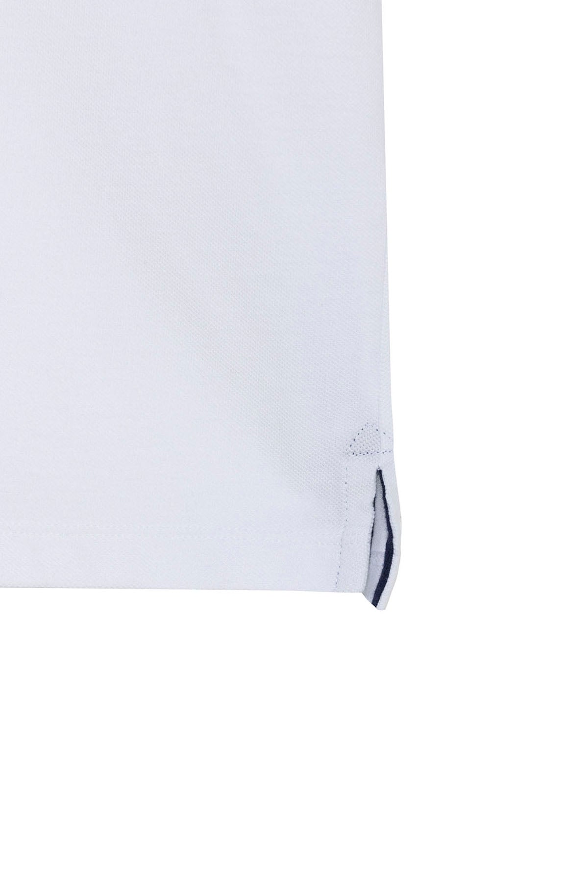 POLO NIÑO BORDADO ESENCIALES BLANCO PURO