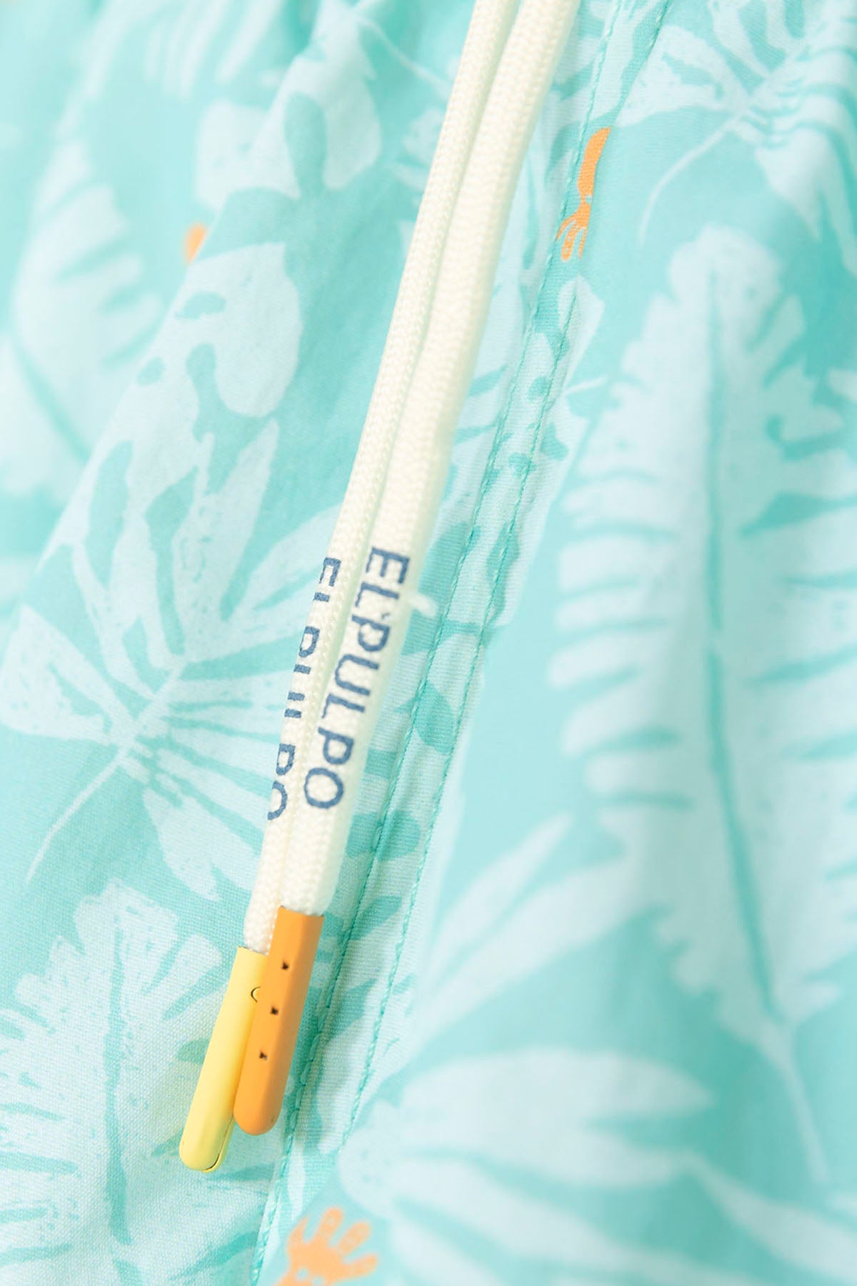 BAÑADOR NIÑO ESTAMPADO SILUETAS HOJAS AZUL TURQUESA