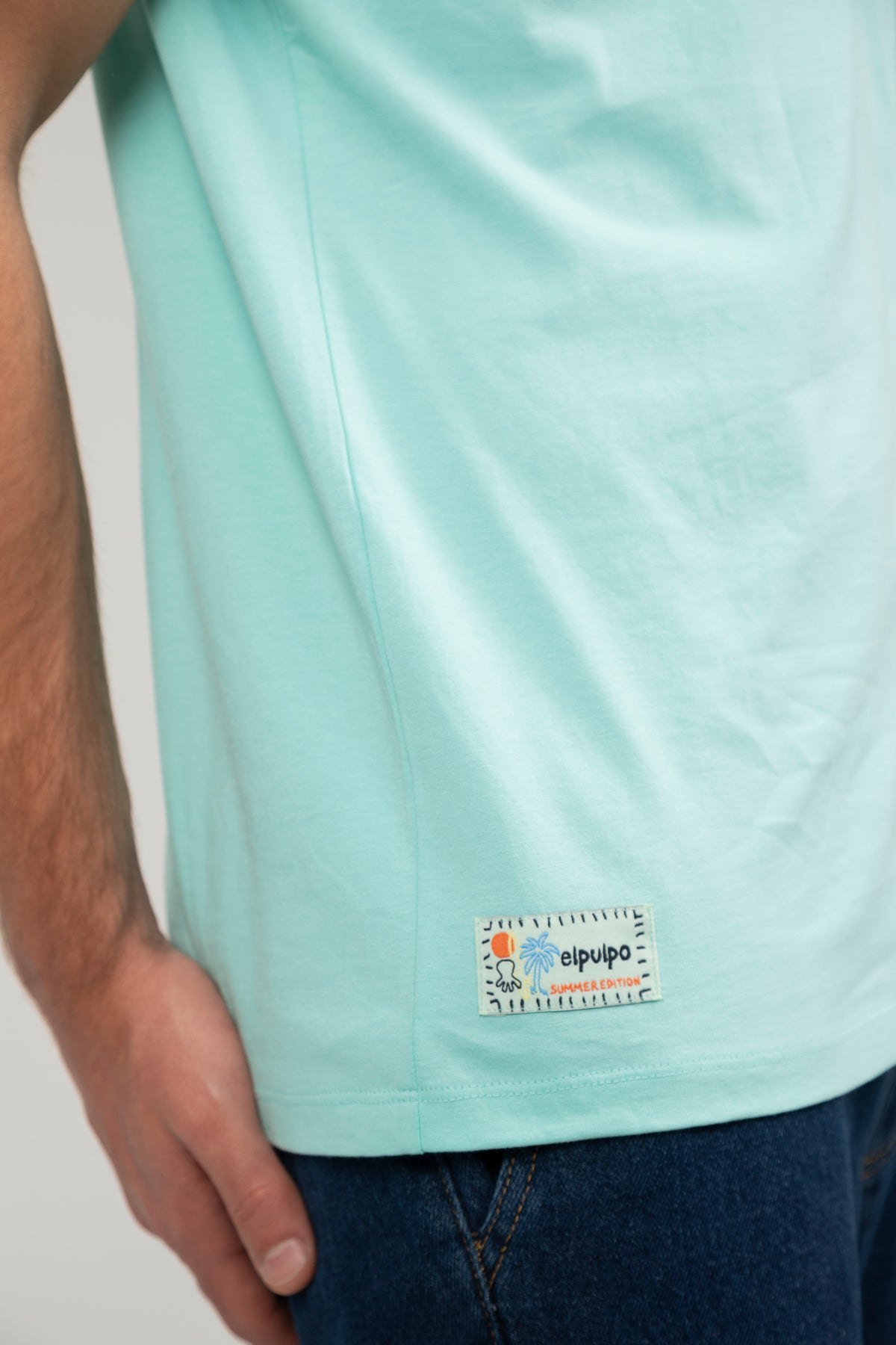 Camiseta logo multiposición verde agua