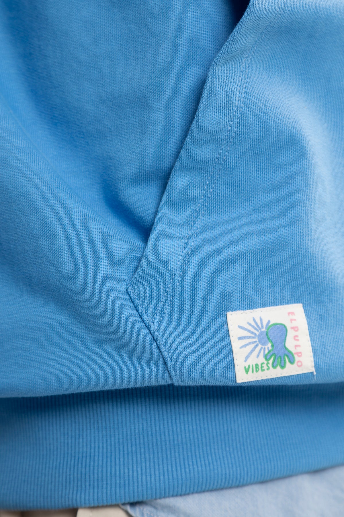 Sudadera capucha logo multiposición azul lavanda