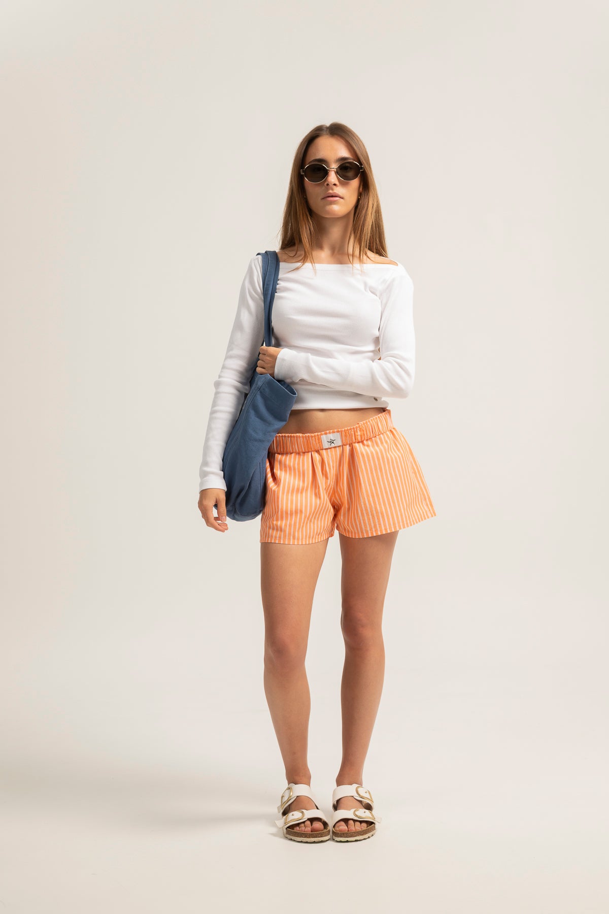Shorts teen rayas naranja