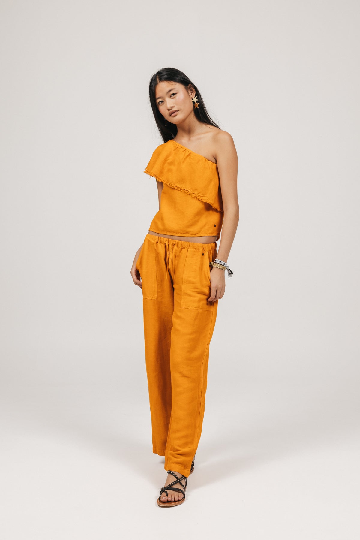 PANTALÓN TEEN FLUIDO BOLSILLOS LATERALES NARANJA DELAVÉ