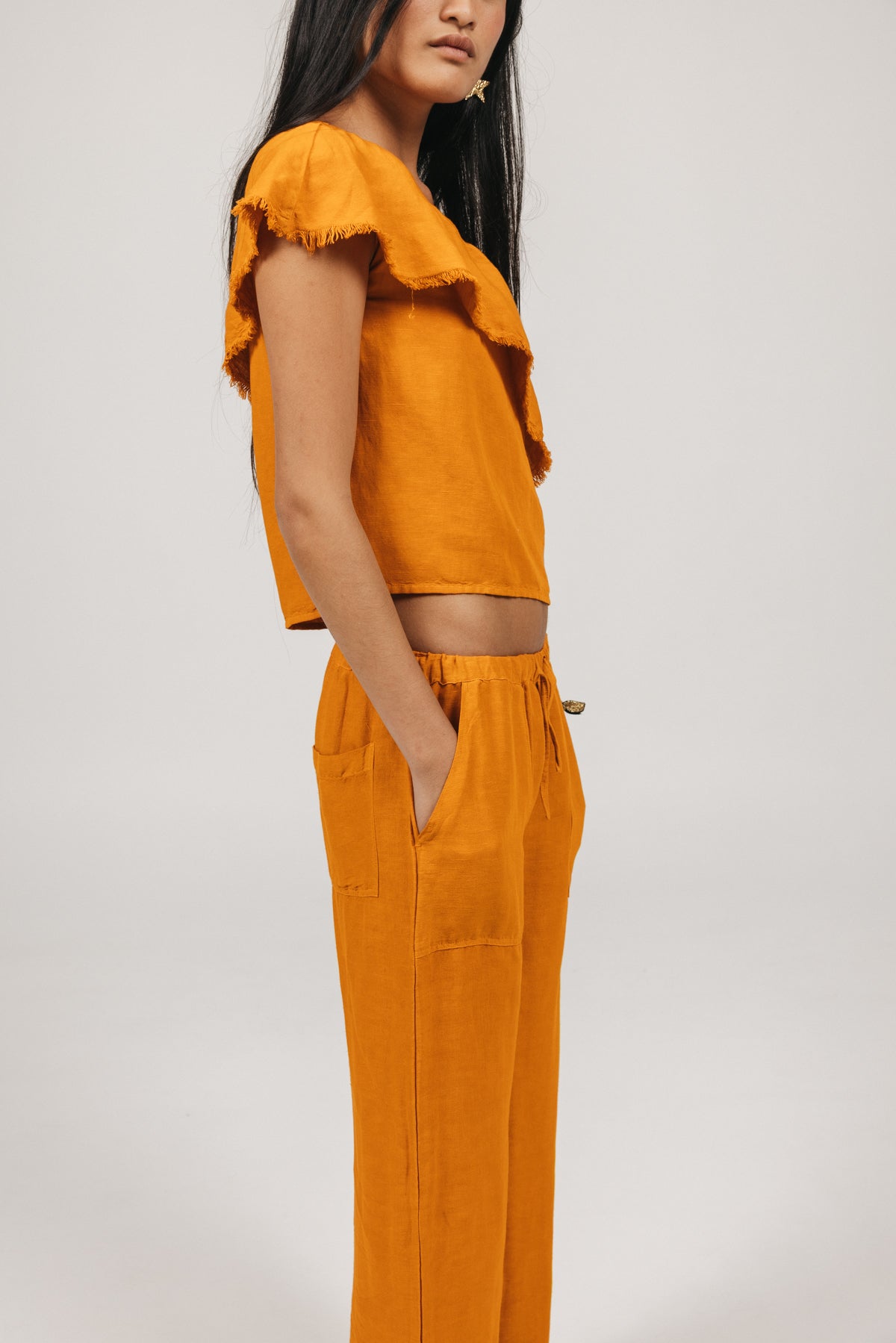 DELAVÉ ORANGE FRAYED RUFFLE TEEN TOP